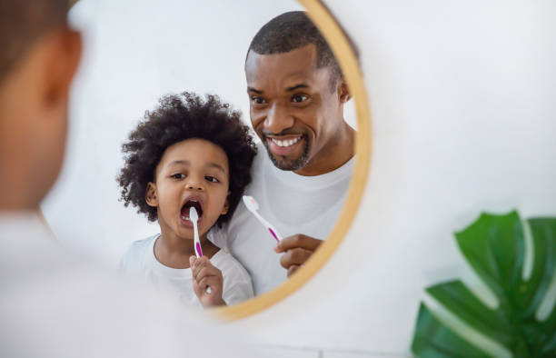W2W FATHER AND SON CLEANING TEETH