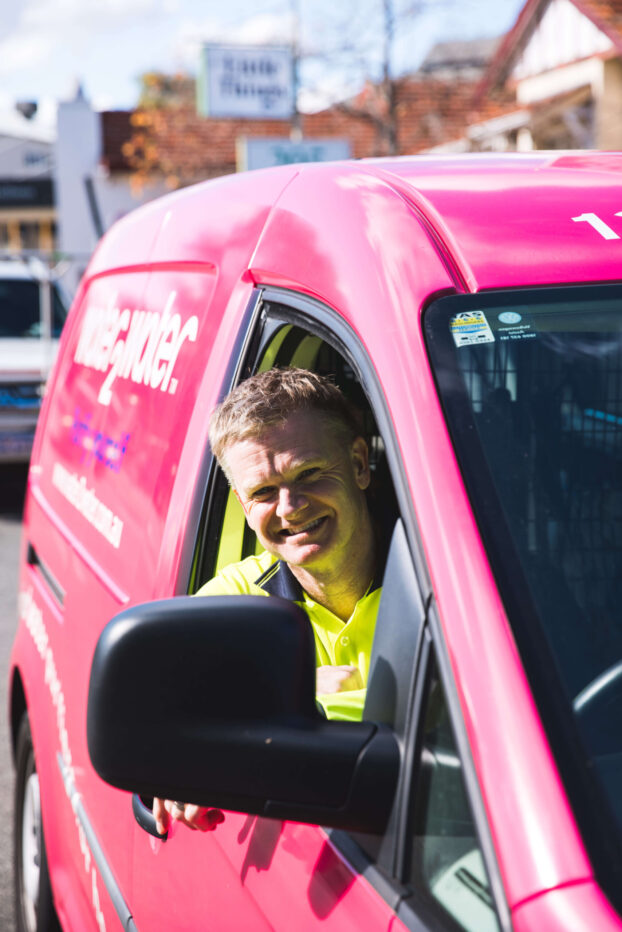 W2W water filtration technician driving W2W branded van to service or repair customer filter system