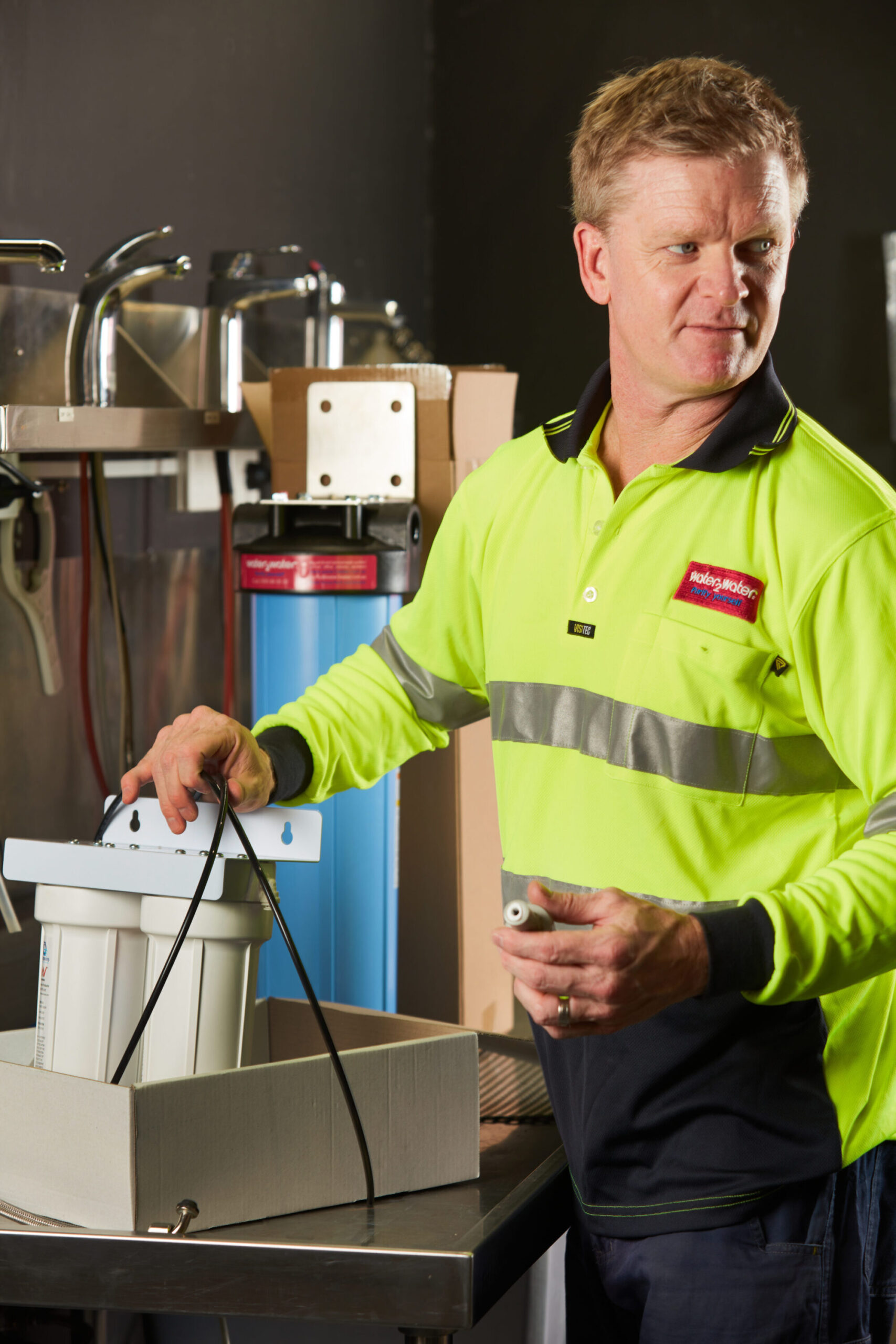 W2W-WATER-FILTRATION-TECHNICIAN-REPAIRING-A-WATER-FILTER-SYSTEM