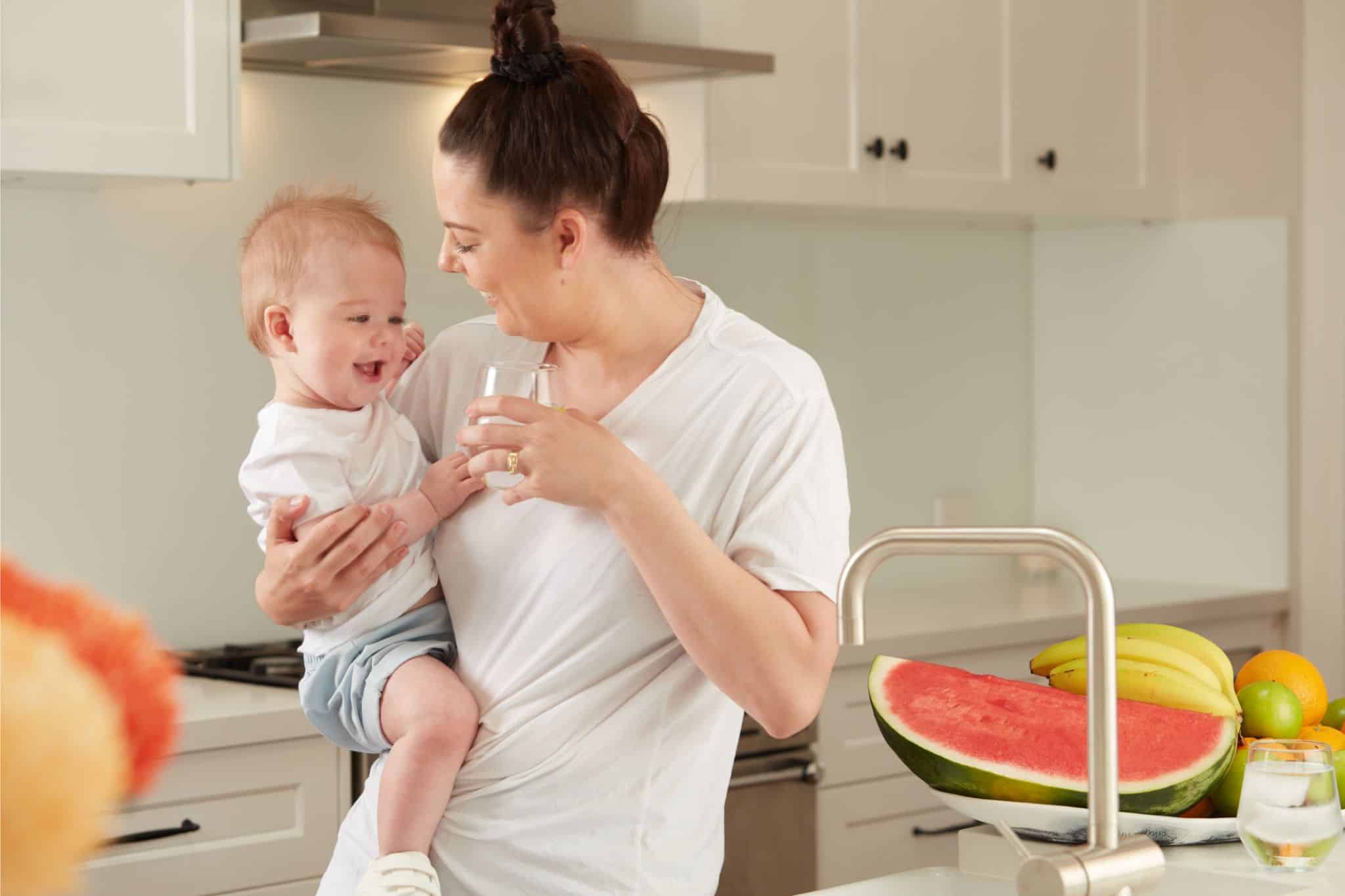 W2W-CUSTOMER-AND-BABY-DRINKING-CHILLED-FILTERED-WATER-IN-KITCHEN