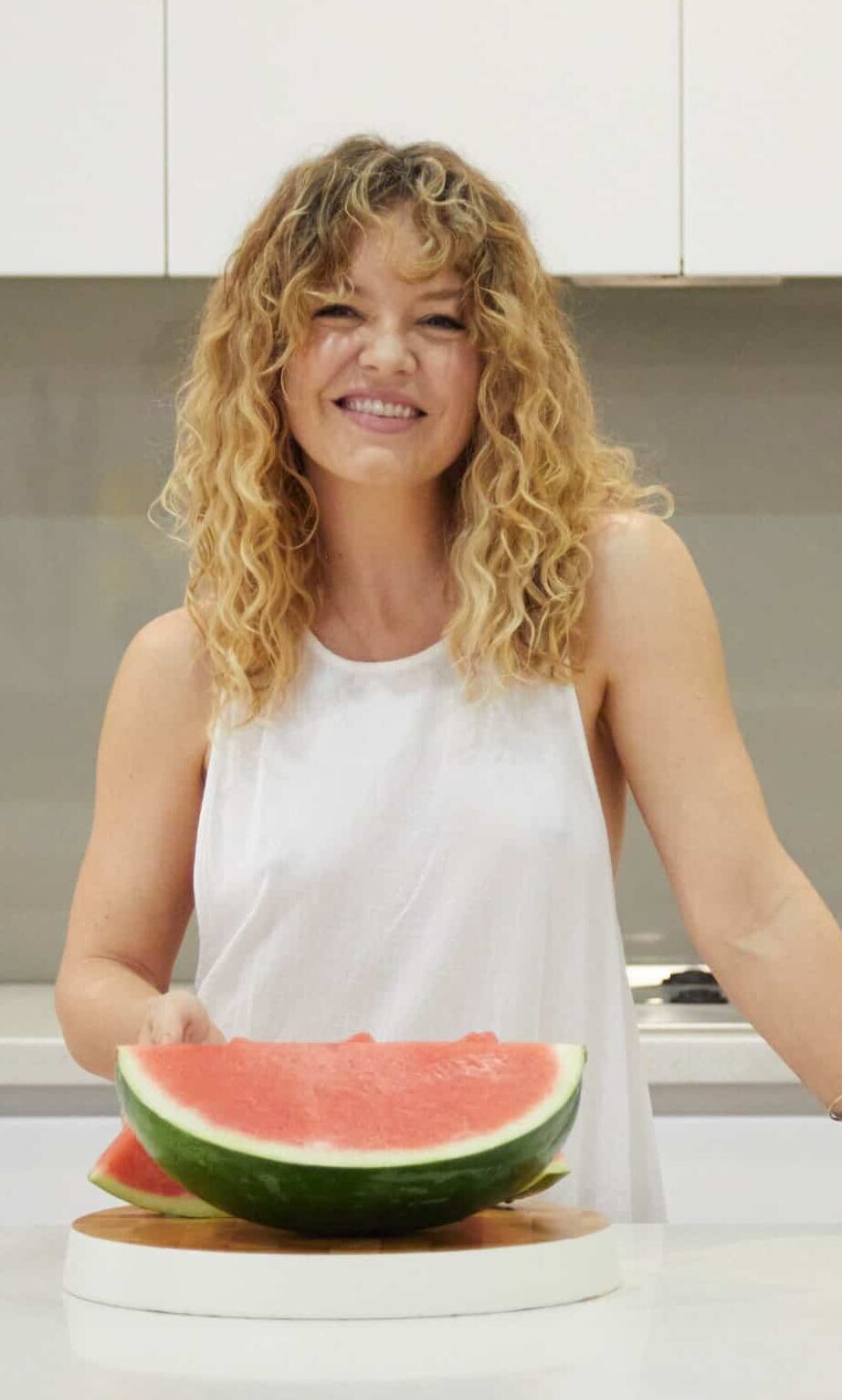 W2W-LADY-LOOKING-HEALTHY-AND-HYDRATED-EATING-WATERMELON