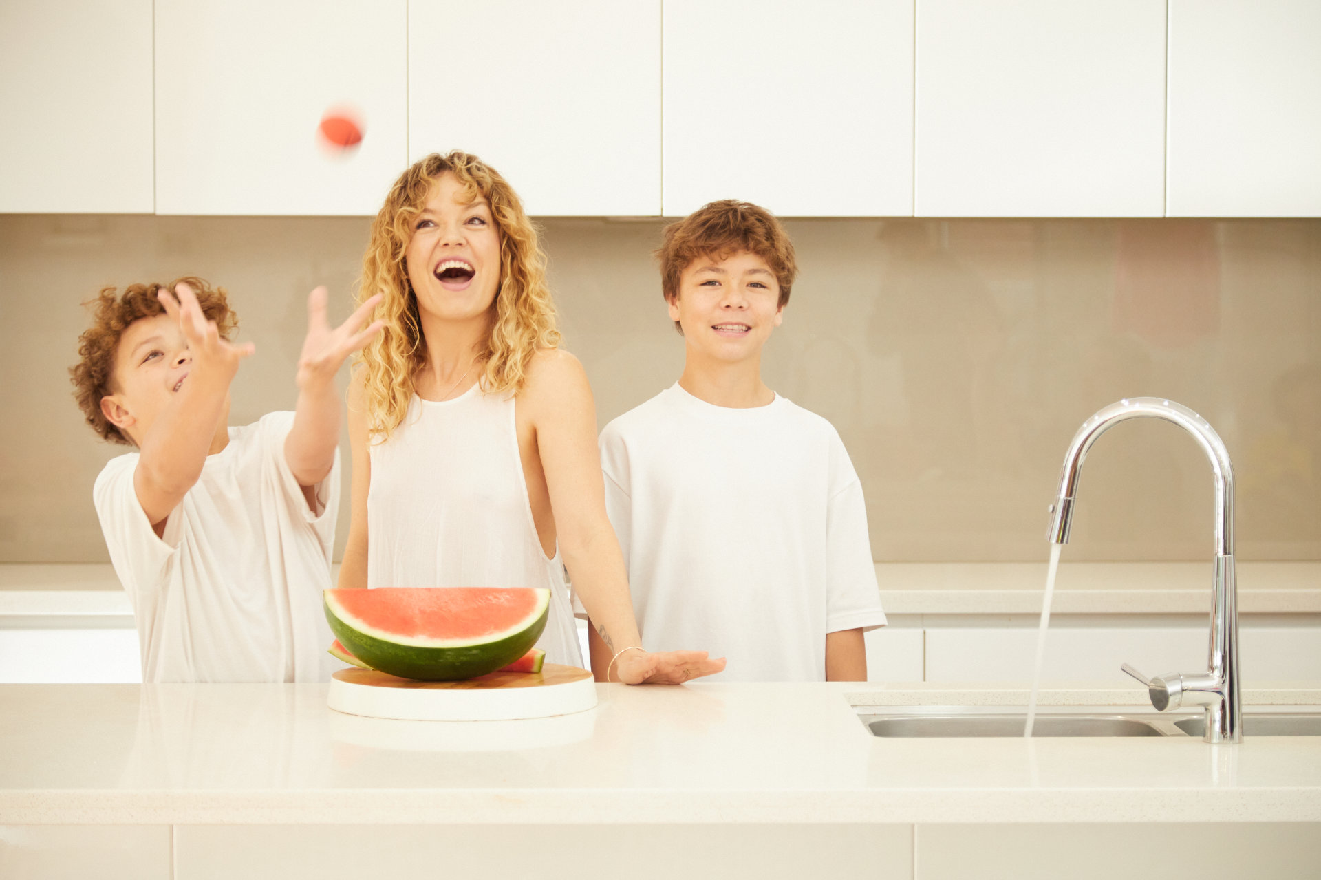 W2W-FAMILY-PLAYING-BALL-IN-KITCHEN