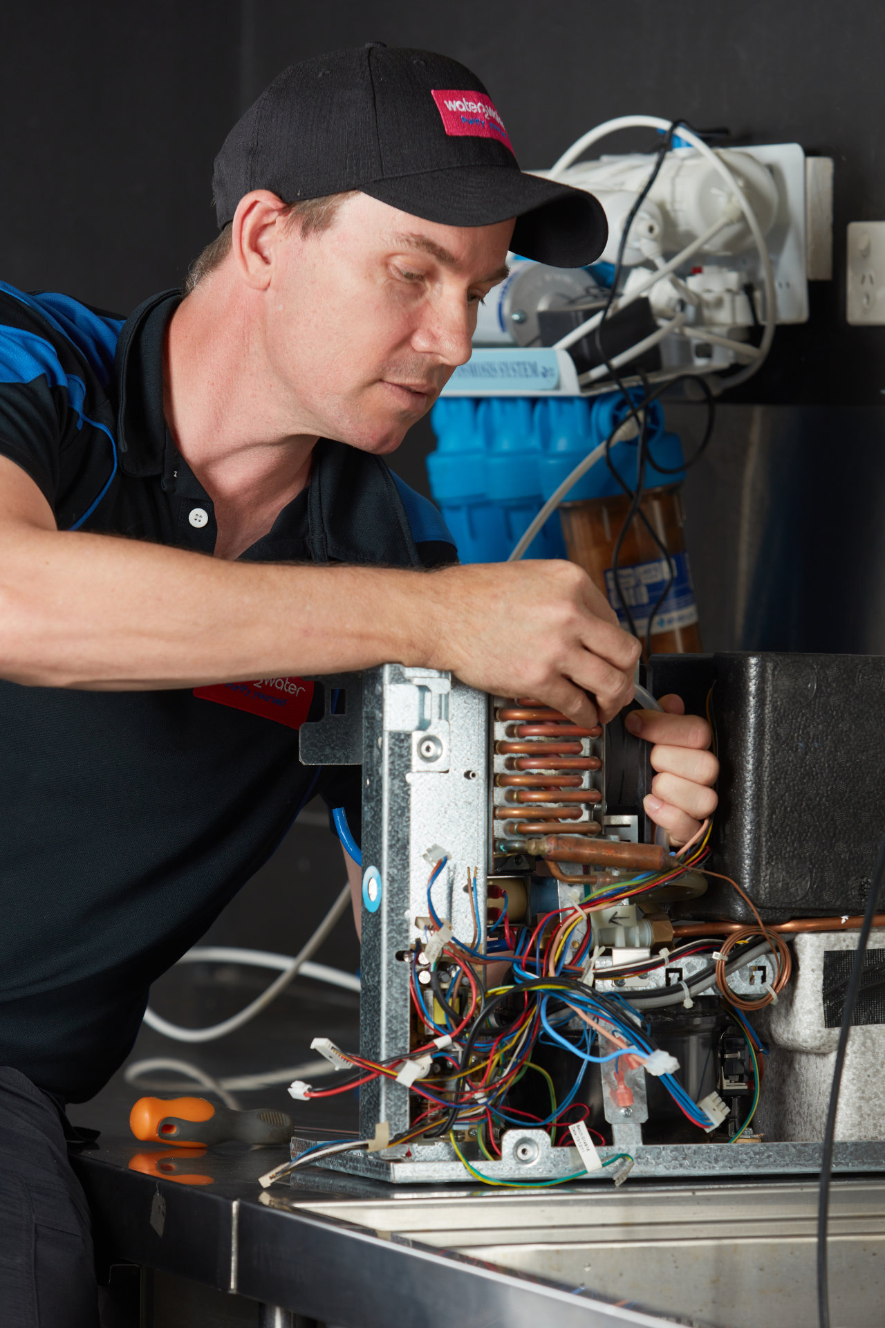 W2W-TECHNICIAN-WORKING-ON-COMMERCIAL-FILTER-SYSTEM-
