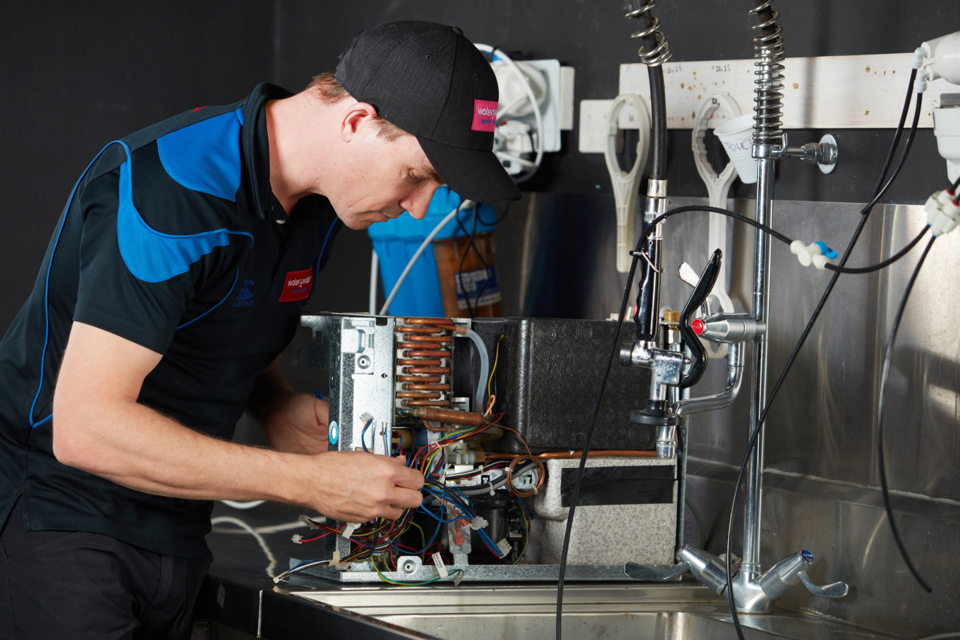 W2W-Water-Filtration-Technician-Repairing-System-in-Worksho